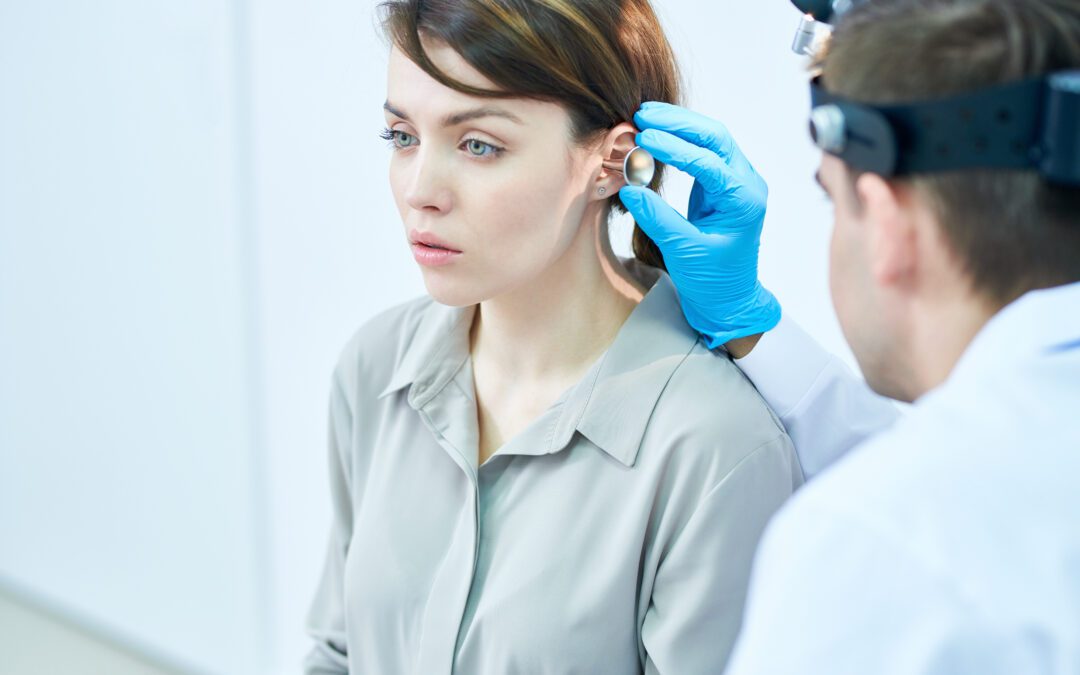 Audiologist in Wenatchee, WA performing a hearing test | Horan and Fevold