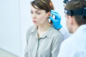 Audiologist in Wenatchee, WA performing a hearing test | Horan and Fevold