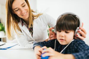 Audiologist in Wenatchee performing a pediatric hearing test | Horan & Fevold Hearing Clinic