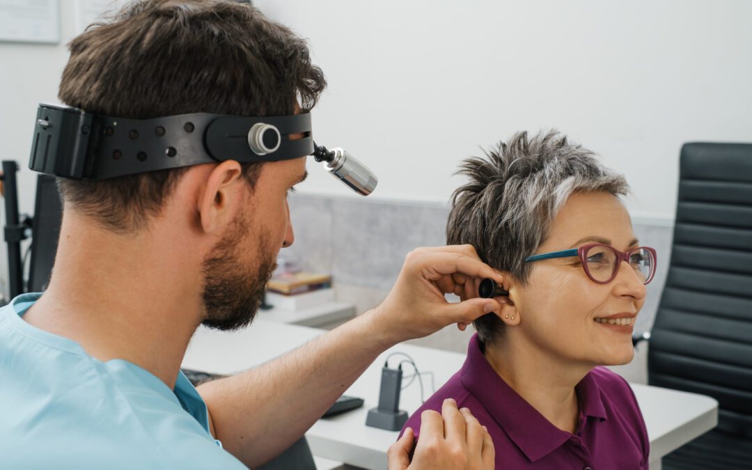 Audiologist performing a hearing test on patient in Wenatchee | Horan and Fevold Hearing Clinic