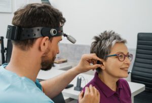 Audiologist performing a hearing test on patient in Wenatchee | Horan and Fevold Hearing Clinic