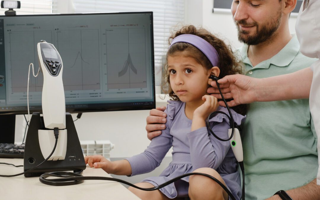Child undergoing a hearing test with an audiologist in Wenatchee, WA, to ensure healthy auditory development and effective communication.