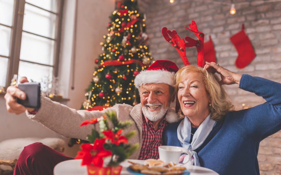 Couple enjoying a festive holiday gathering in Wenatchee, highlighting the importance of hearing health for the season.