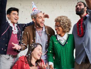 friends celebrating new years eve and healthy hearing becuase of hearing tests in wenatchee